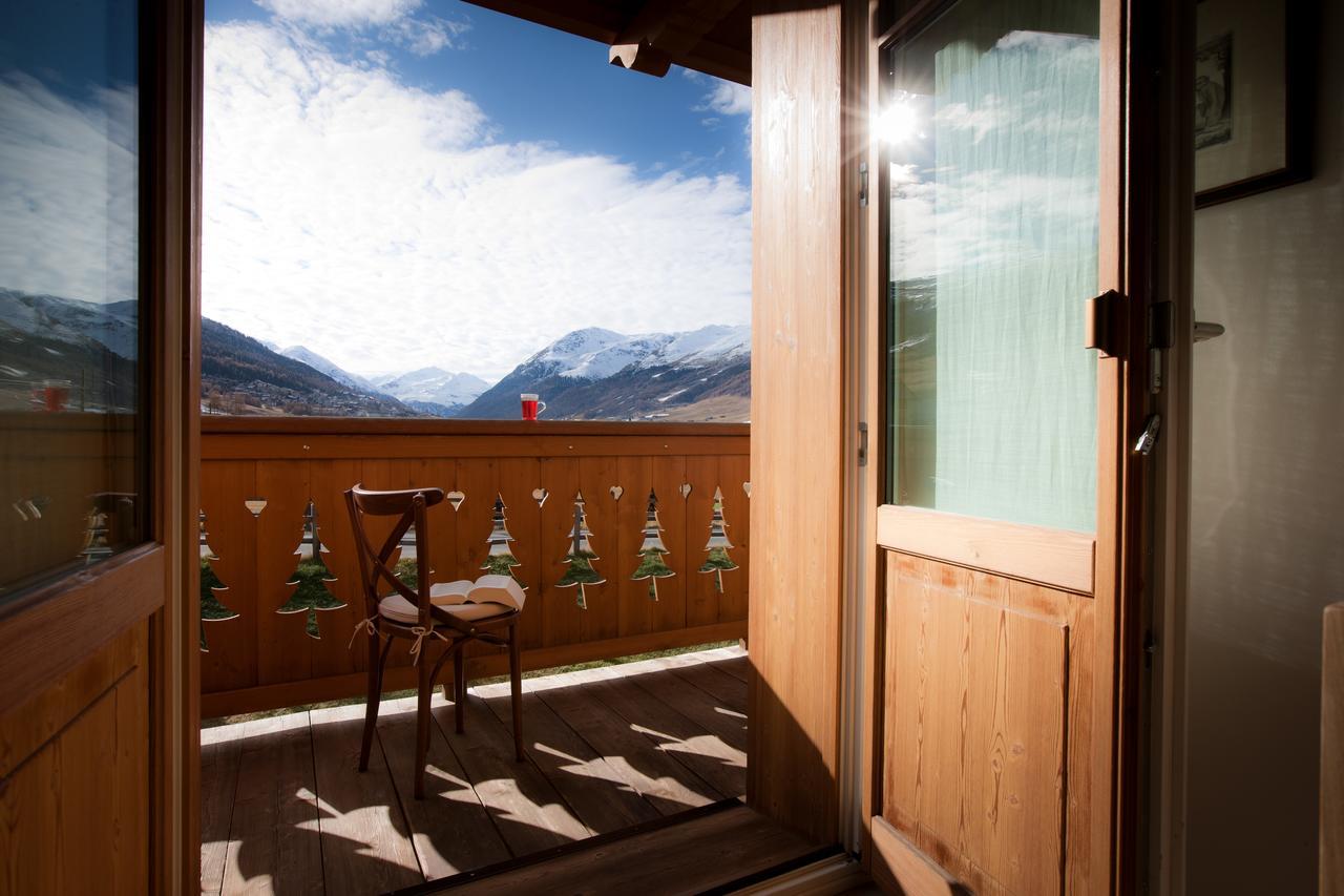 Les Fleurs Bleues Aparthotel Livigno Exteriör bild